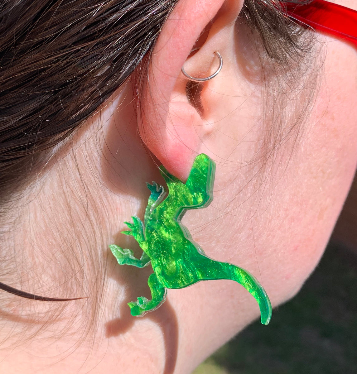 Green on sale dinosaur earrings