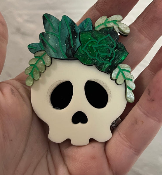 Skull planter brooch