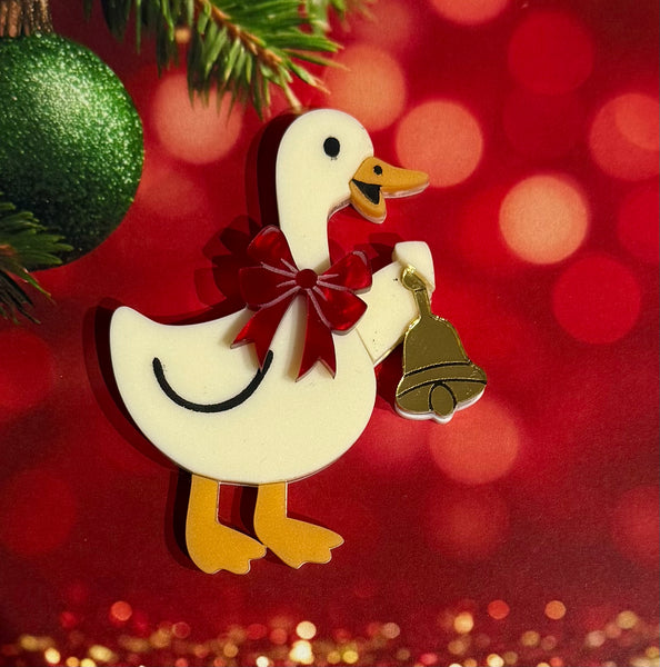 Goosey with a bell brooch